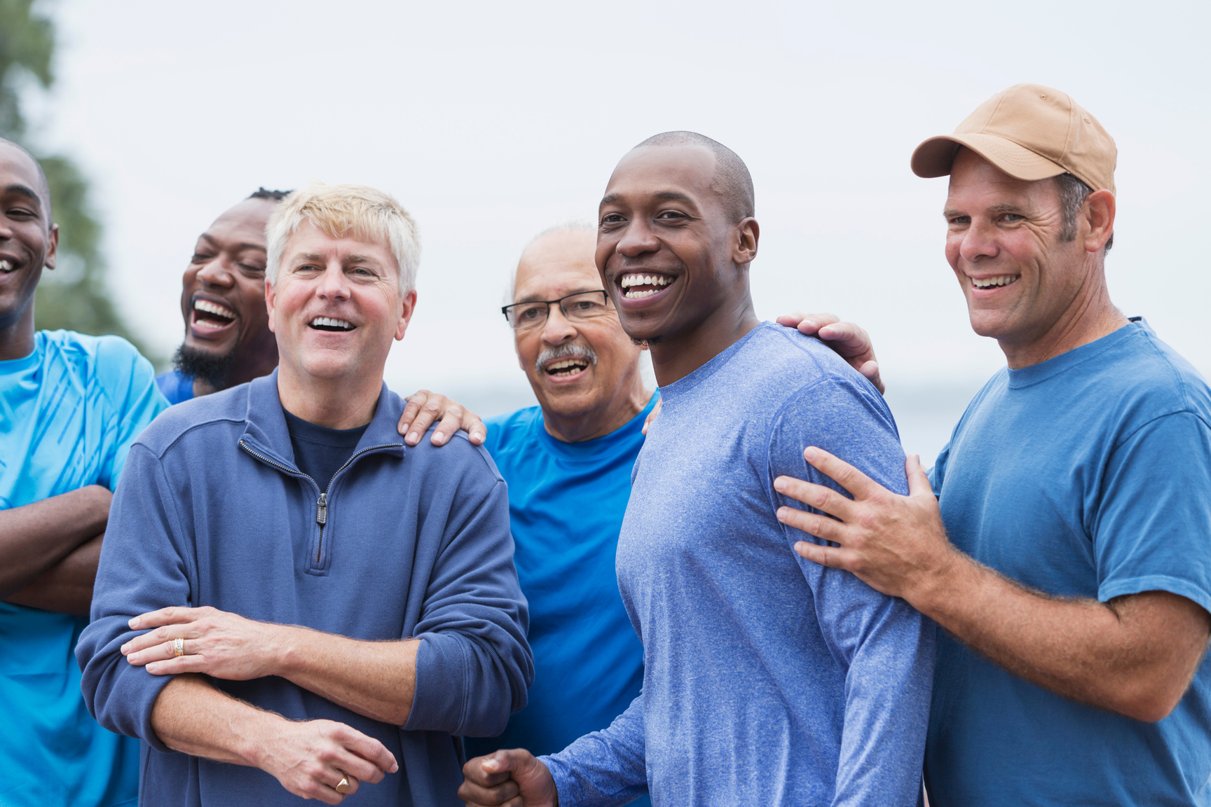 Diverse group of men standing together